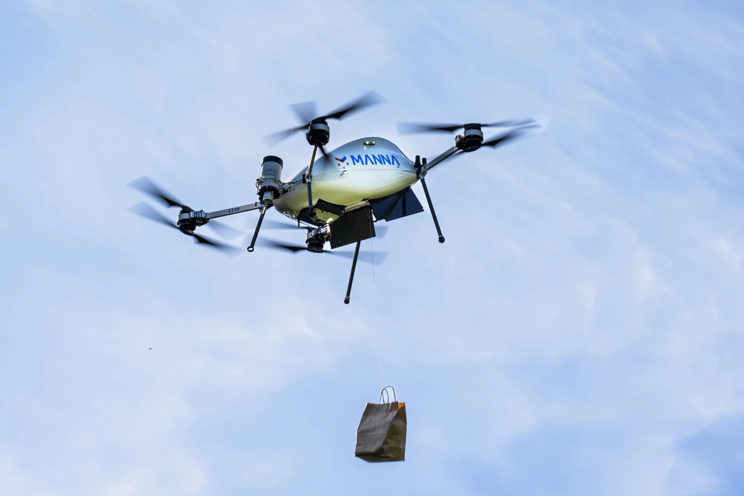 A drone delivering a food bag.